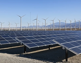 image of solar panels and wind turbines