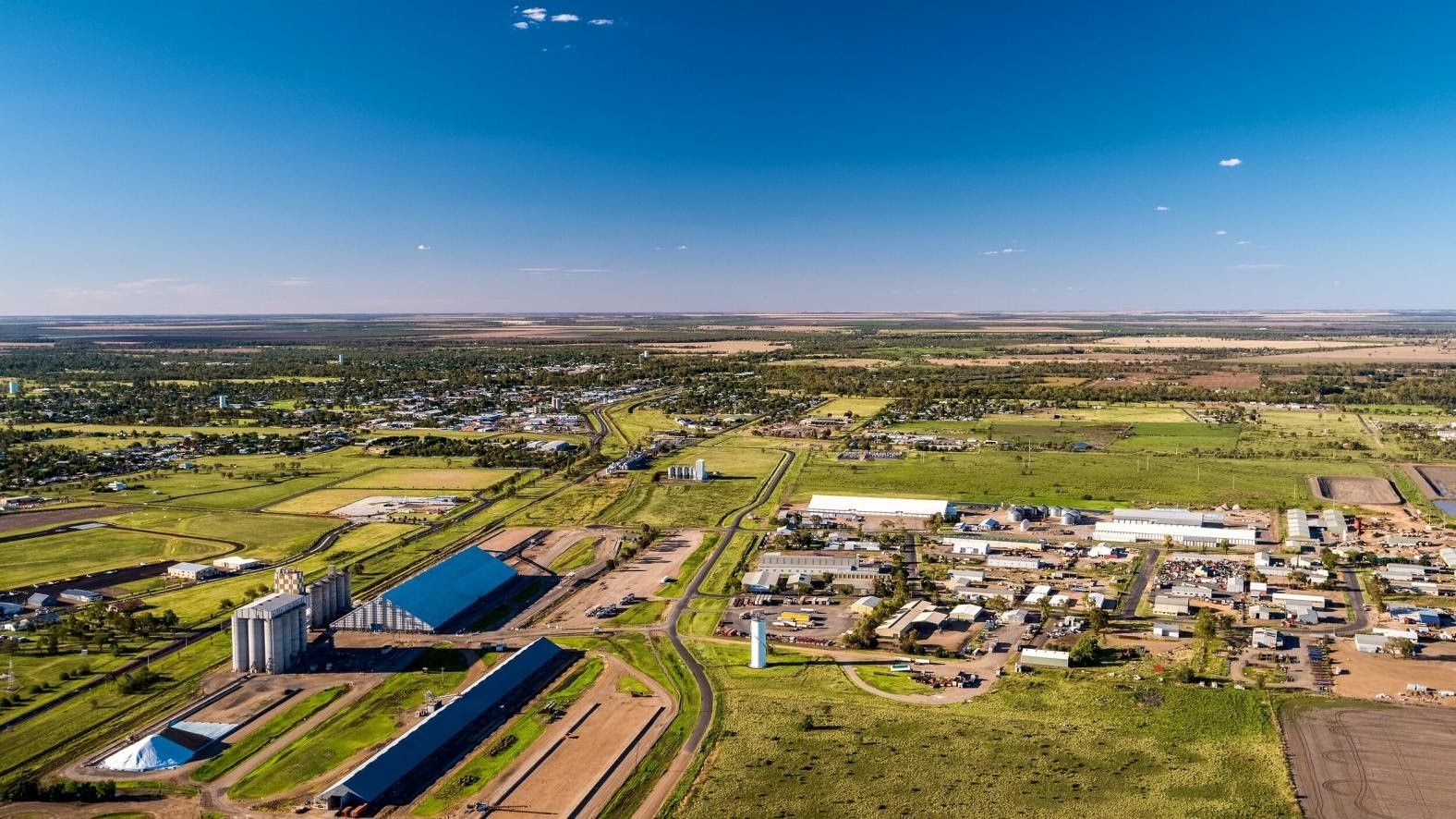 An aerial view of a sunny day across houses and businesses of Moree