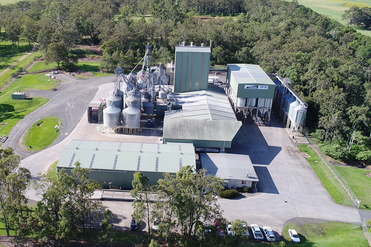 Aerial view of a factory surrounded by green trees in the Richmond Valley area